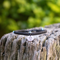 Silver Disc with Black Heart on Box Knot Cord