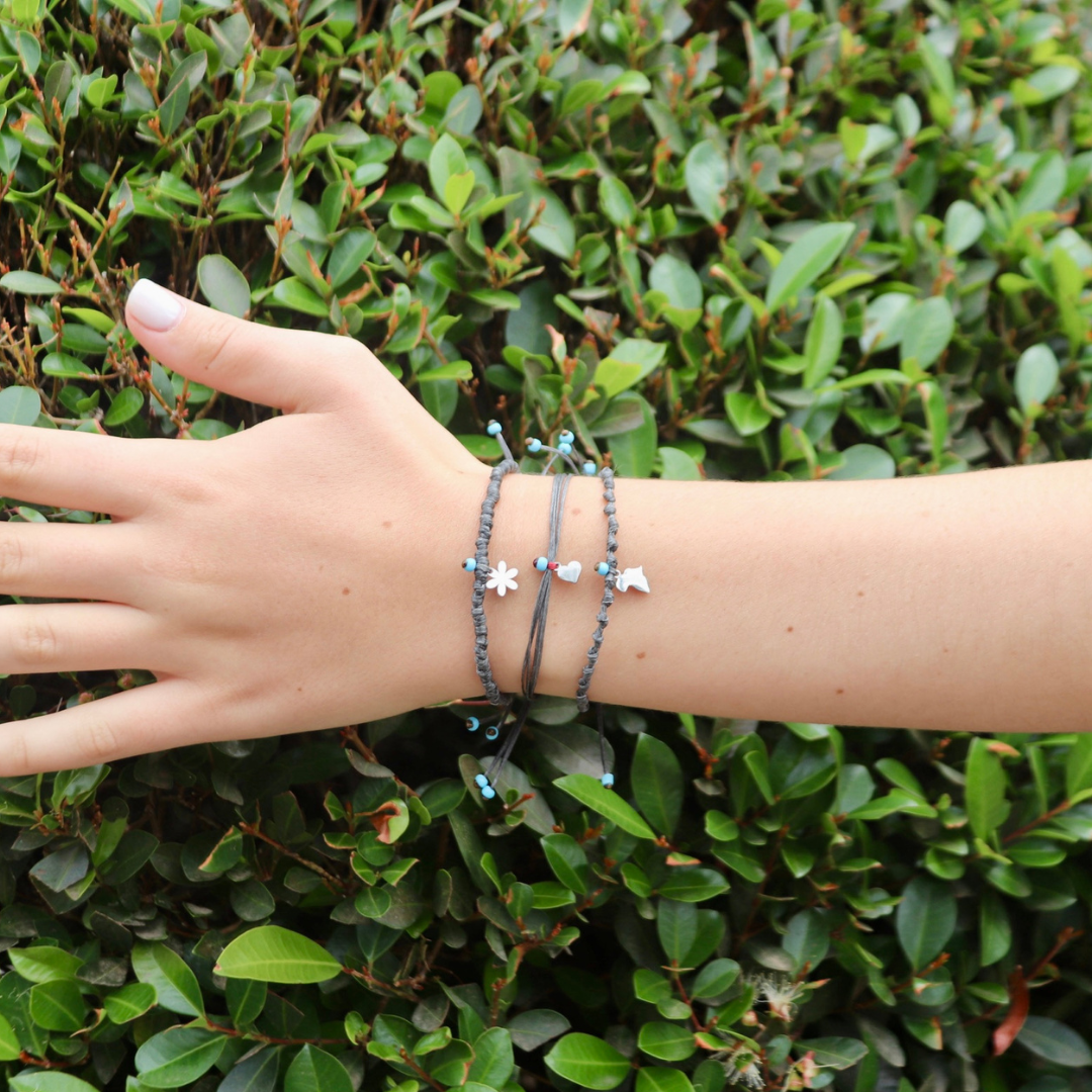 Charms on Grey Coloured Cord