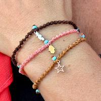 Mixed Charms on Pebbled Cord