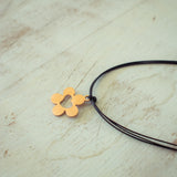Rose Gold Flower Charm with Cut Out Heart on Black Cord