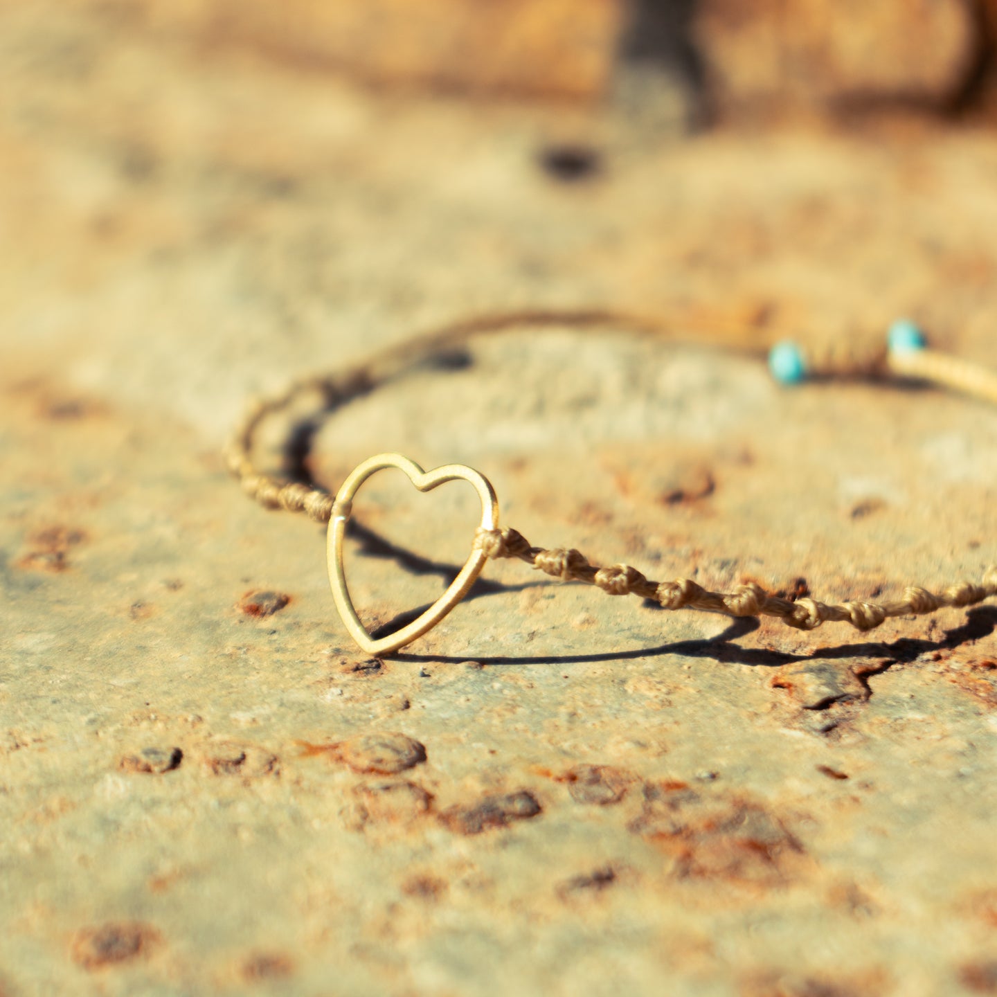 Gold Hollow Heart on Intermittent Cord