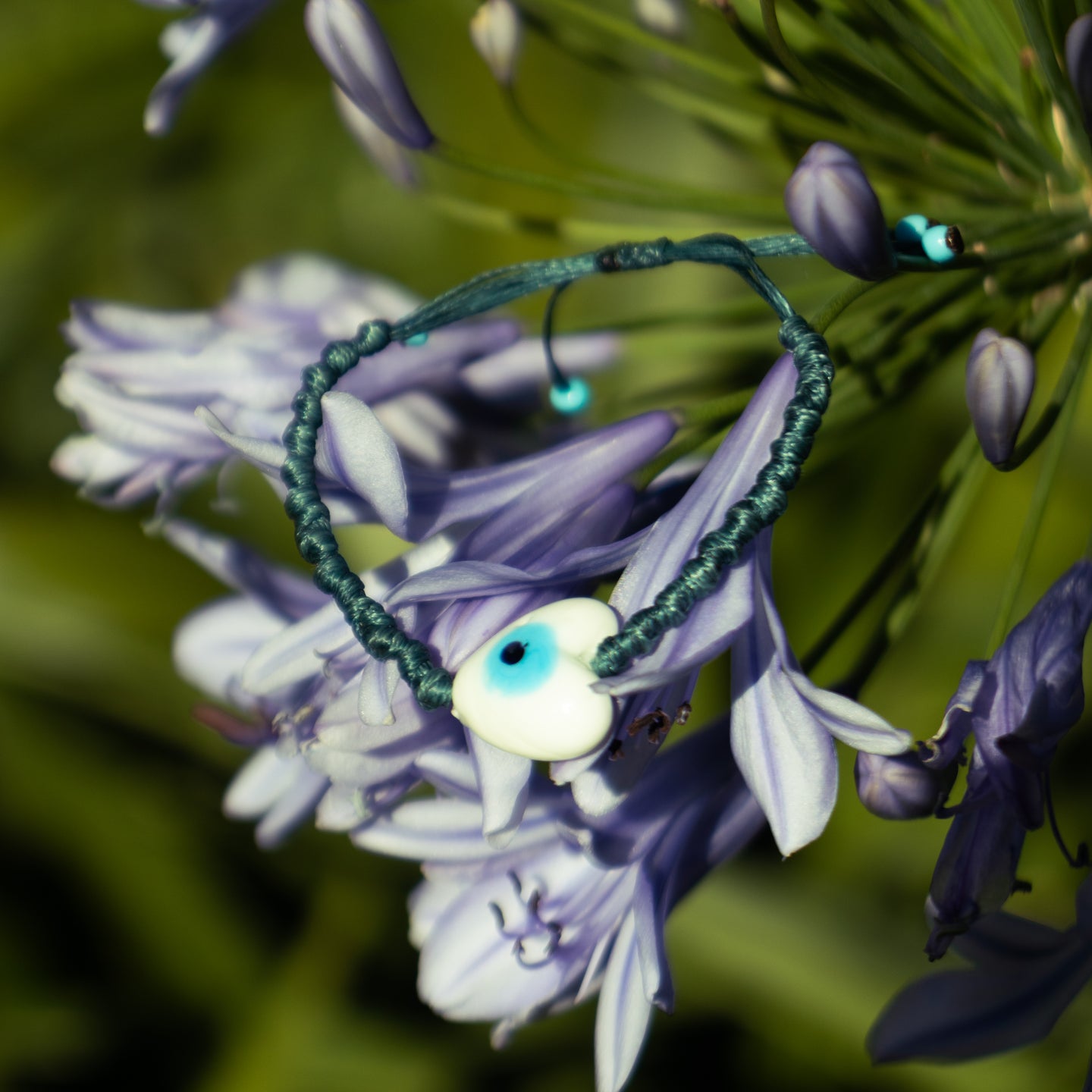 Evil Eye Charm on Woven Teal Pebbled Bracelet