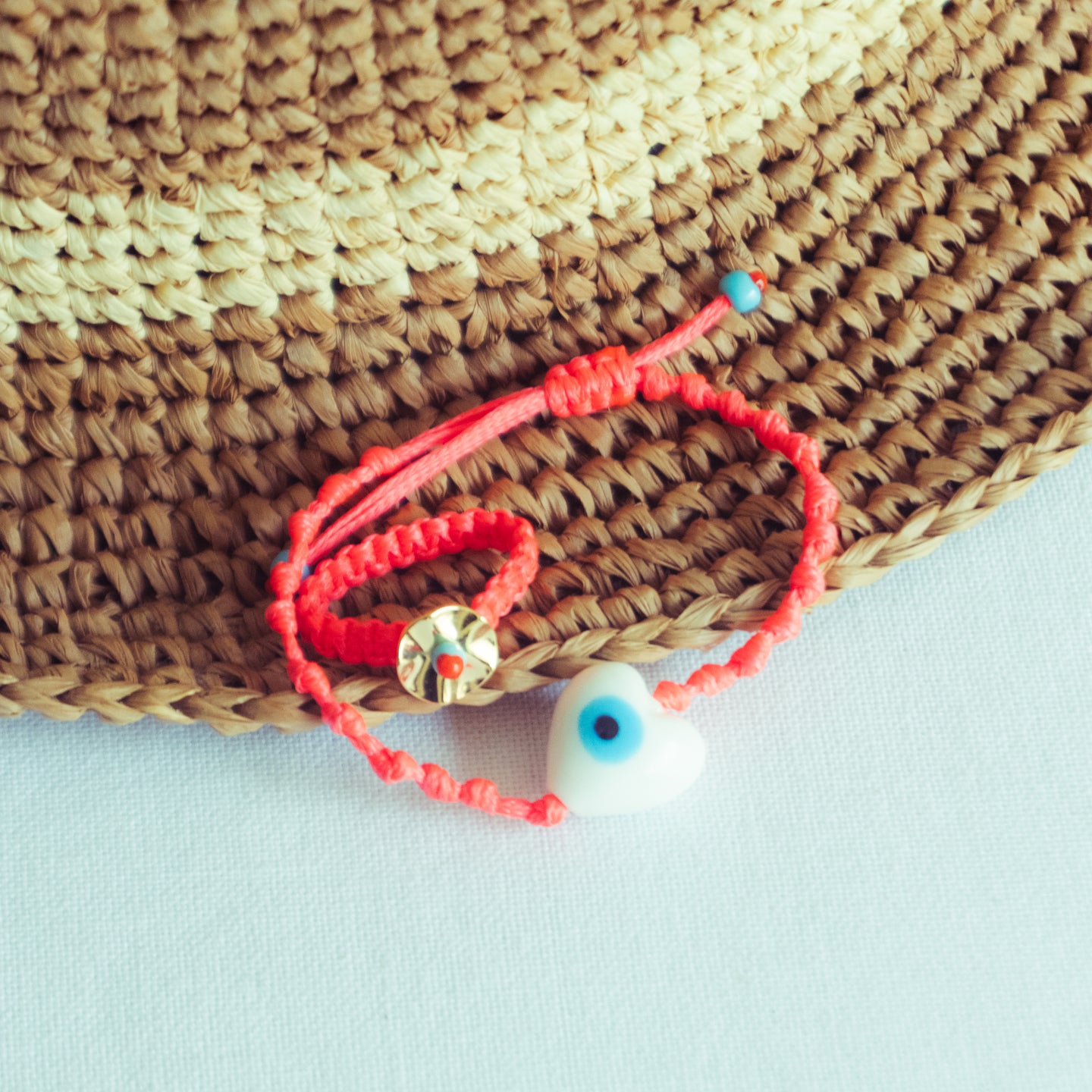 Evil Eye Bracelet with Pebbled Ring on Box Knot Cord